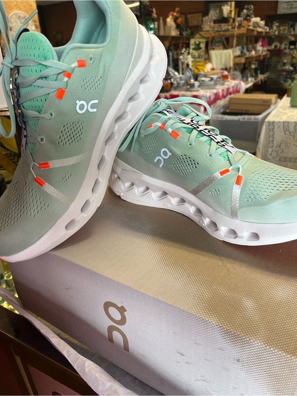 OnCloud CloudRunning Men’s Mint and White Athletic Sneakers with Orange Accents